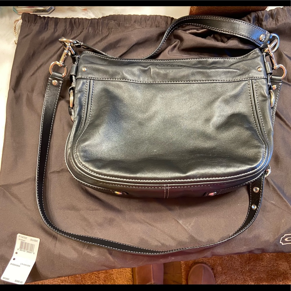 Coach black leather shoulder/cross body.